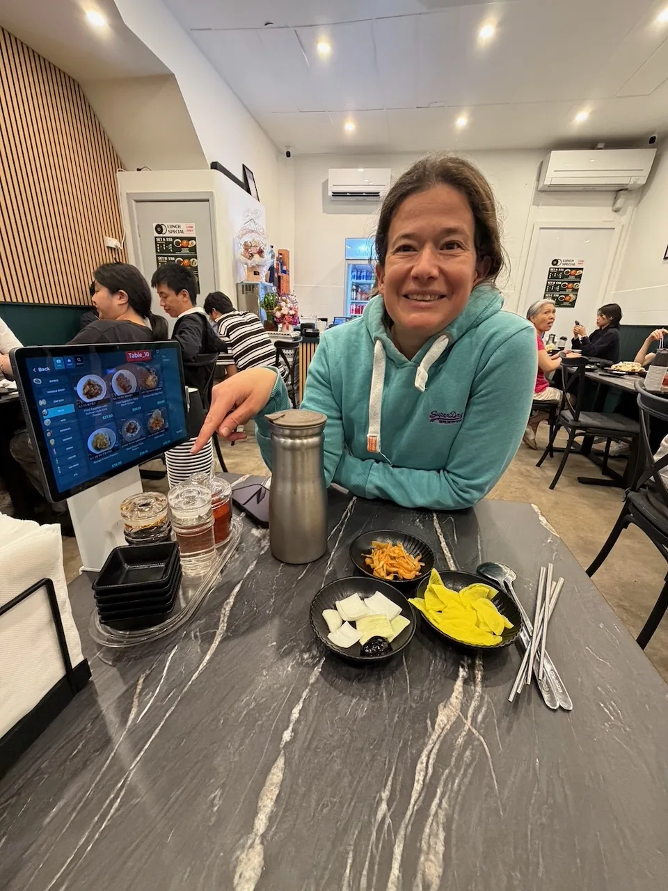 Steph sitting at a Korean restaurant in Lidcombe on the first evening of the trip.